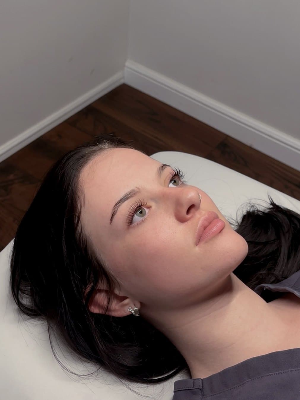 Lauren Clark on the treatment bed in the studio